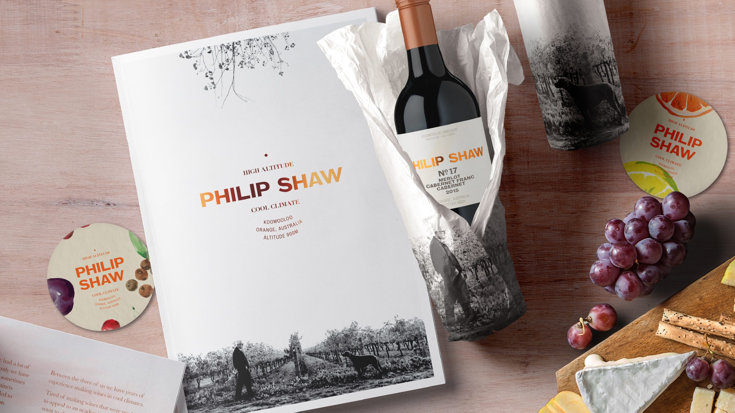 Philip Shaw Wines products arranged on a bench top with grapes and a chessboard. Image highlights the brand and packaging designed by Helium Design Melbourne.