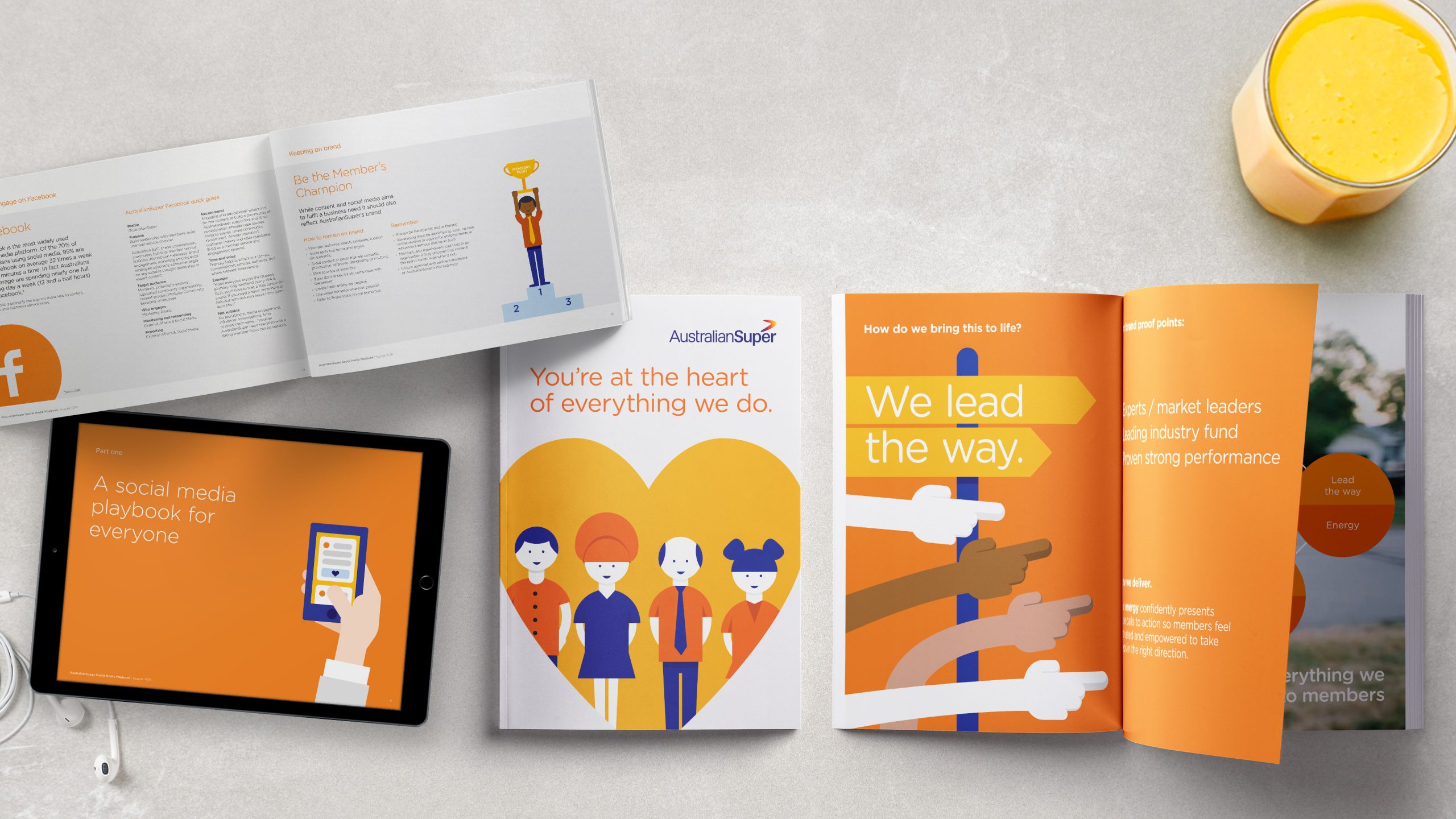 AustralianSuper Brand Guideline documents on a bench top. Documents designed by Helium Design Melbourne