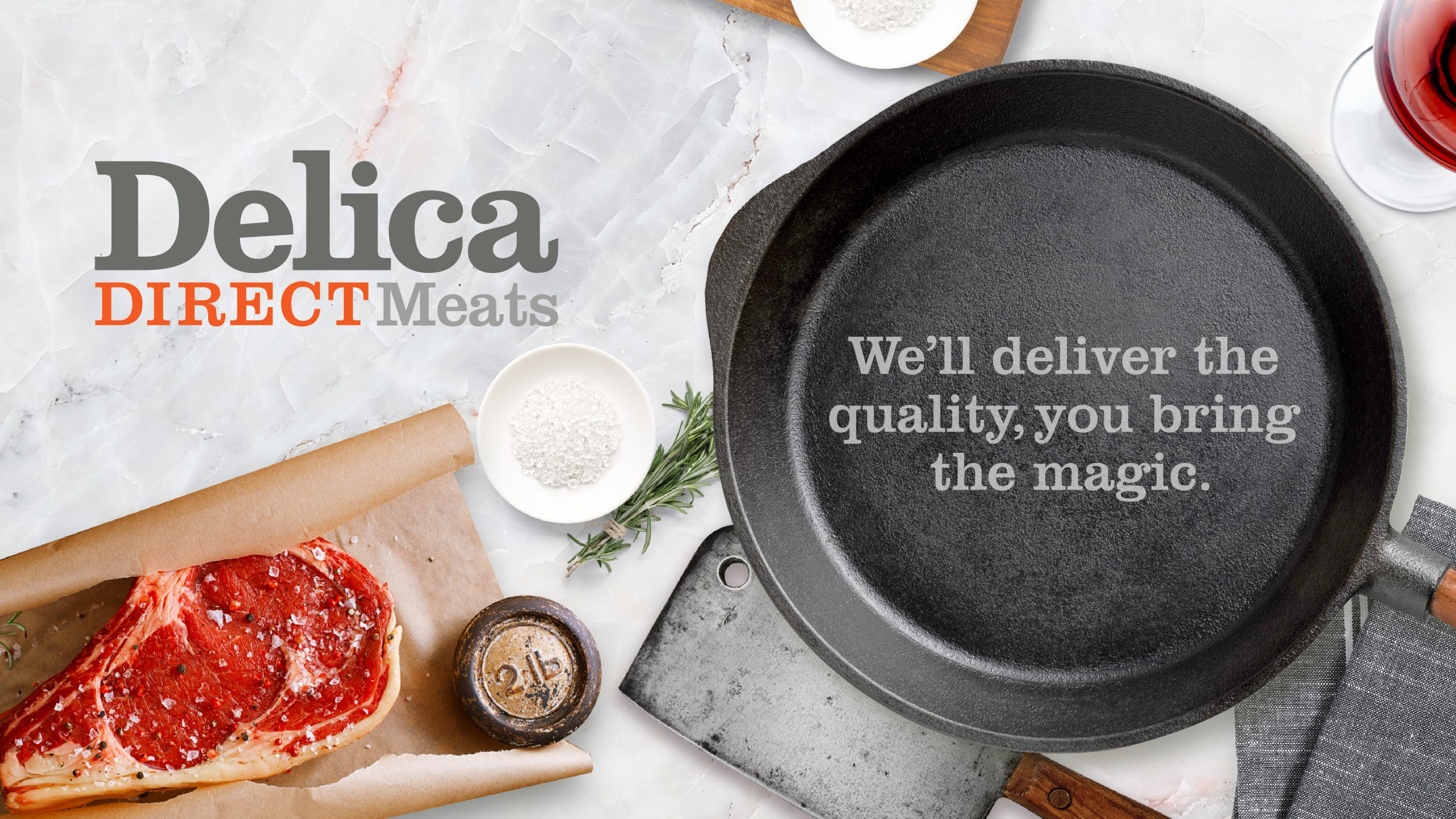 Delica Direct Meats Branding featuring a logotype, an aerial image of a bench top displaying a cut of meat, a frying pan, cleaver, red wine and salt. The identity was designed by Helium Design Melbourne.